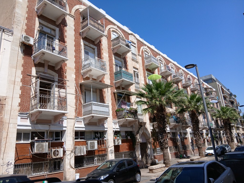 An old brick building with balconies