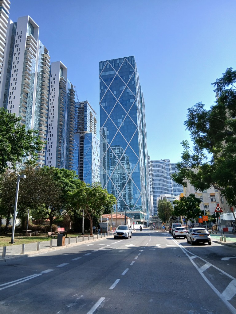 A glass tower with lines like a net