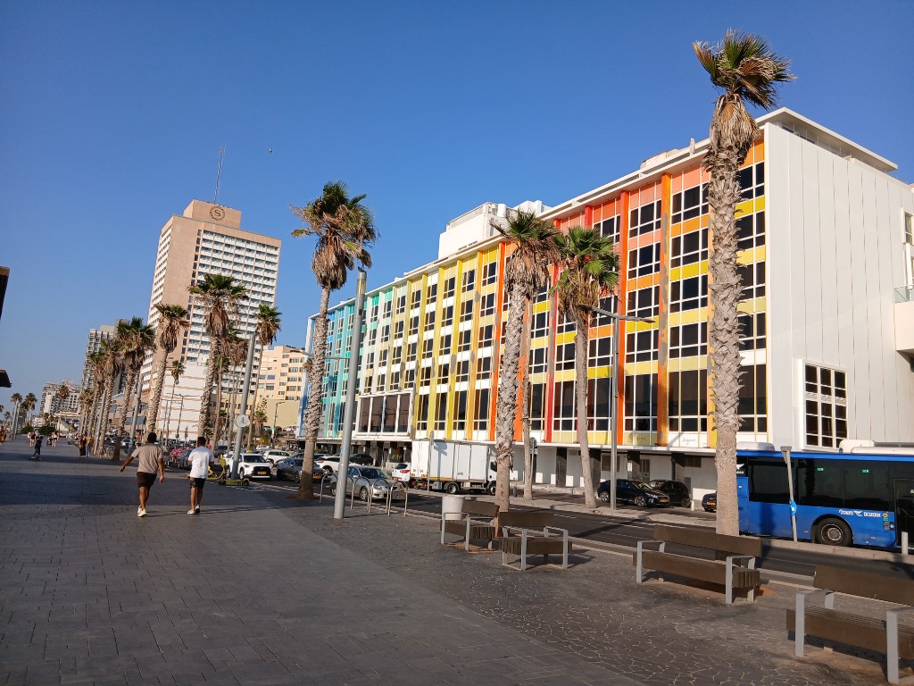 A hotel in all the colours of the rainbow, and a blue bus